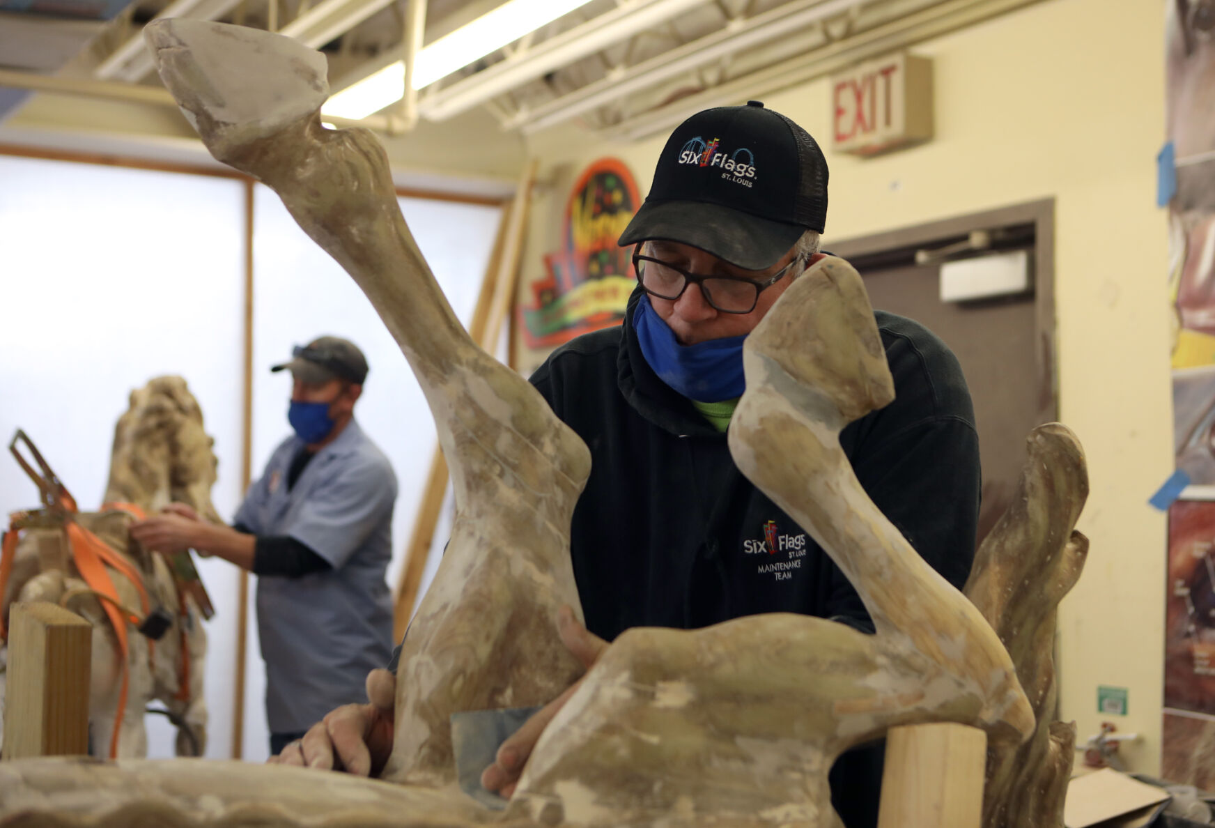 Jeremy Farrell and Steve Read refurbish carousel horses